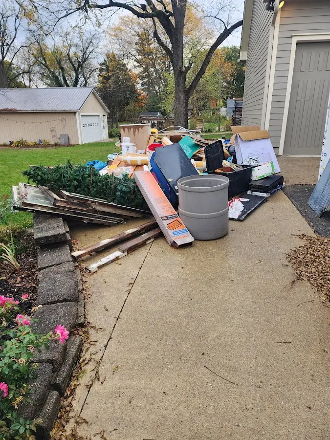 Dumpster being loaded with debris for Demolition Dumpster Rental in Benton City